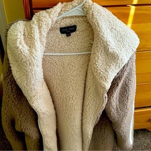 Taupe color fleece light weight jacket .